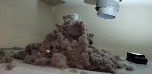 Lint from a Dryer Booster Fan in Ceiling